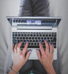 Woman with laptop on the lap