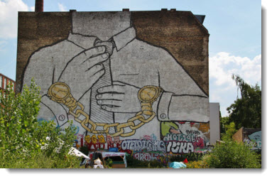 Street art - Man with a suit in chains 