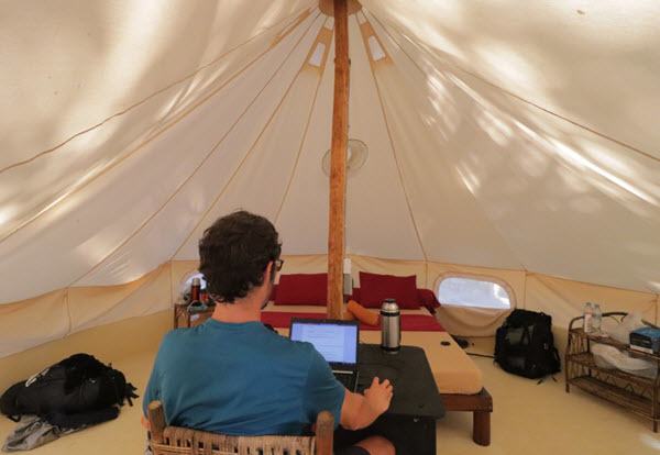 Working inside a tepee tent in cambodia